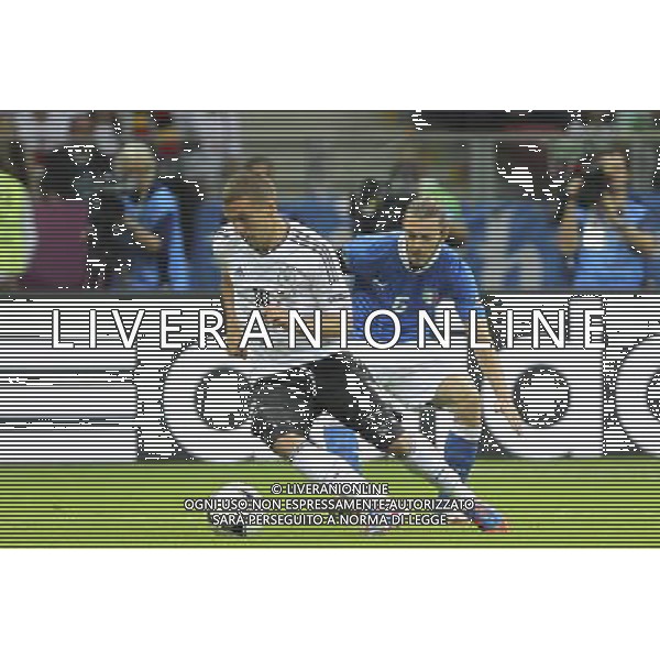 28.06.2012 WARSZAWA - STADION NARODOWY ( WARSAW POLAND NATIONAL STADIUM) PILKA NOZNA (FOOTBALL ) MISTRZOSTWA EUROPY W PILCE NOZNEJ UEFA EURO 2012 ( EUROPEAN CHAMPIONSHIPS UEFA EURO 2012 ) POLFINAL (SEMIFINAL) MECZ NIEMCY - WLOCHY ( GAME GERMANY - ITALY) NZ LUKAS PDOLSKI ( L) FEDERICO BALZARETTI ( P) FOTO KATARZYNA PLEWCZYNSKA/CYFRASPORT --- Newspix.pl EUROPEI 2012 GERMANIA ITALIA AG ALDO LIVERANI SAS - ITALY ONLY - *** Local Caption *** www.newspix.pl mail us: info@newspix.pl call us: 0048 022 23 22 222 --- Polish Picture Agency by Ringier Axel Springer Poland