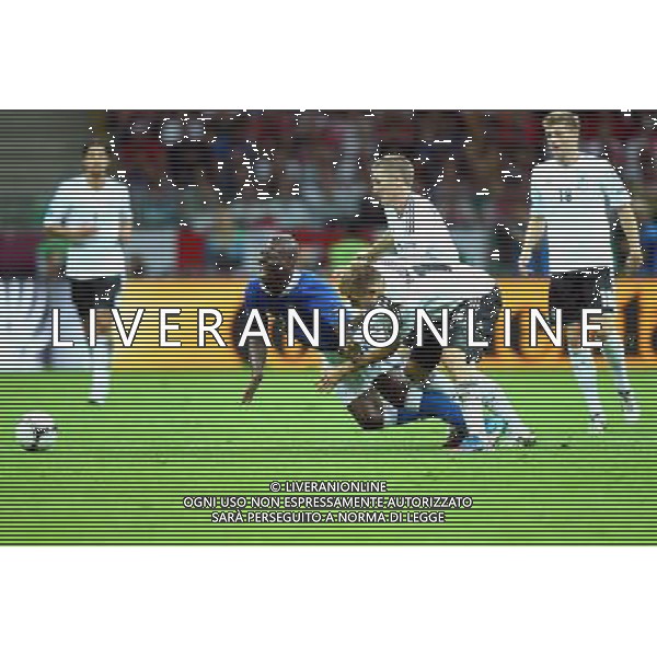 28.06.2012 WARSZAWA - STADION NARODOWY ( WARSZAWA POLAND NATIONAL STADIUM) PILKA NOZNA (FOOTBALL ) MISTRZOSTWA EUROPY W PILCE NOZNEJ UEFA EURO 2012 ( EUROPEAN CHAMPIONSHIPS UEFA EURO 2012 ) POLFINAL ( SEMI-FINALS ) MECZ NIEMCY - WLOCHY ( GAME GERMANY - ITALY ) NZ MARIO BALOTELLI (L), BASTIAN SCHWEINSYEIGER, HOLGER BADSTUBER (P) FOTO LUKASZ GROCHALA/CYFRASPORT --- Newspix.pl EUROPEI 2012 GERMANIA ITALIA AG ALDO LIVERANI SAS - ITALY ONLY - *** Local Caption *** www.newspix.pl mail us: info@newspix.pl call us: 0048 022 23 22 222 --- Polish Picture Agency by Ringier Axel Springer Poland