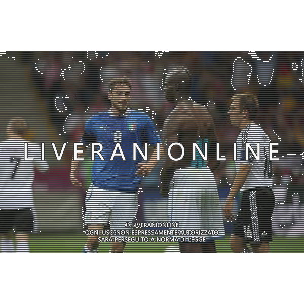 WARSZAWA 28.06.2012 MECZ MISTRZOSTWA EUROPY 2012 POLFINAL: NIEMCY - WLOCHY --- UEFA EURO 2012 CHAMPIONSHIP SEMIFINAL MATCH IN WARSAW: GERMANY - ITALY CLAUDIO MARCHISIO MARIO BALOTELLI PHILIPP LAHM FOT. PIOTR KUCZA --- Newspix.pl EUROPEI 2012 GERMANIA ITALIA AG ALDO LIVERANI SAS - ITALY ONLY - *** Local Caption *** www.newspix.pl mail us: info@newspix.pl call us: 0048 022 23 22 222 --- Polish Picture Agency by Ringier Axel Springer Poland