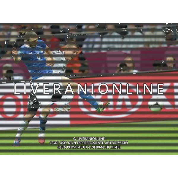 (120629) -- WARSAW, June 29, 2012 () -- Federico Balzaretti (L) of Italy vies with Lukas Podolski of Germany during the semifinal match between Germany and Italy at the Euro 2012 football championships in Warsaw, Poland, June 28, 2012. (/Liu Lihang) (jyc) PHOTOSHOT/AG ALDO LIVERANI SAS - ITALY ONLY -