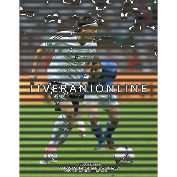 (120629) -- WARSAW, June 29, 2012 () -- Mesut Oezil (L) of Germany runs with the ball during the semifinal match between Germany and Italy at the Euro 2012 football championships in Warsaw, Poland, June 28, 2012. (/Liu Lihang) (jyc) PHOTOSHOT/AG ALDO LIVERANI SAS - ITALY ONLY -