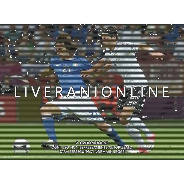 (120629) -- WARSAW, June 29, 2012 () -- Andrea Pirlo (L) of Italy vies with Mesut Oezil of Germany during the semifinal match between Germany and Italy at the Euro 2012 football championships in Warsaw, Poland, June 28, 2012. (/Ma Ning) (jyc) PHOTOSHOT/AG ALDO LIVERANI SAS - ITALY ONLY -