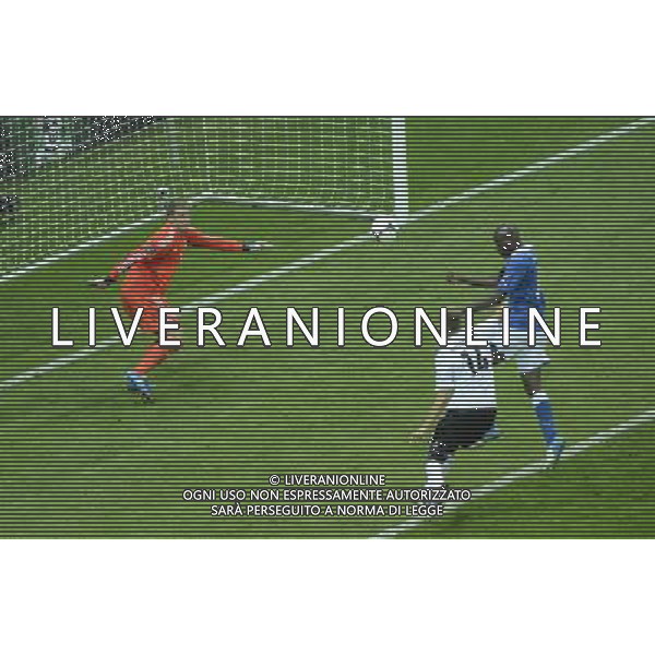 (120629) -- WARSAW, June 29, 2012 () -- Mario Balotelli (R) of Italy scores during the semifinal match between Germany and Italy at the Euro 2012 football championships in Warsaw, Poland, June 28, 2012. (/Wu Wei) (jyc) PHOTOSHOT/AG ALDO LIVERANI SAS - ITALY ONLY -
