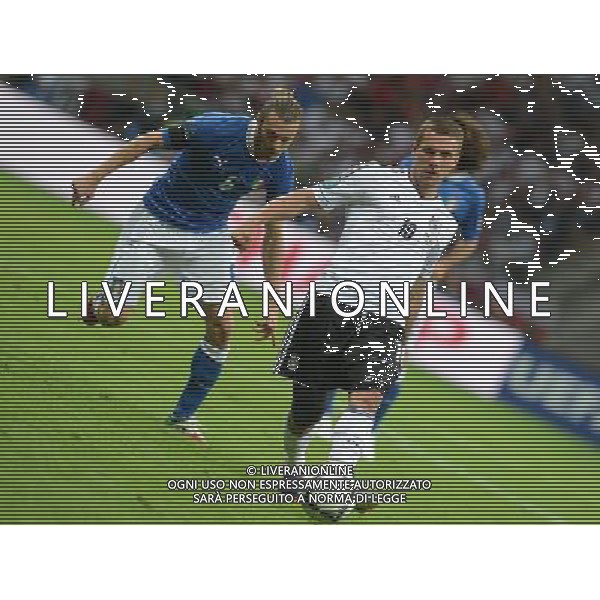 (120629) -- WARSAW, June 29, 2012 () -- Lukas Podolski (R) of Germany vies with Federico Balzaretti of Italy during the semifinal match between Germany and Italy at the Euro 2012 football championships in Warsaw, Poland, June 28, 2012. (/Ma Ning) (jyc) PHOTOSHOT/AG ALDO LIVERANI SAS - ITALY ONLY -
