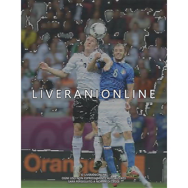 (120629) -- WARSAW, June 29, 2012 () -- Federico Balzaretti (R) of Italy vies with Bastian Schweinsteiger of Germany during the semifinal match between Germany and Italy at the Euro 2012 football championships in Warsaw, Poland, June 28, 2012. Italy won 2-1 to enter the final. (/Ma Ning) (jyc) PHOTOSHOT/AG ALDO LIVERANI SAS - ITALY ONLY -