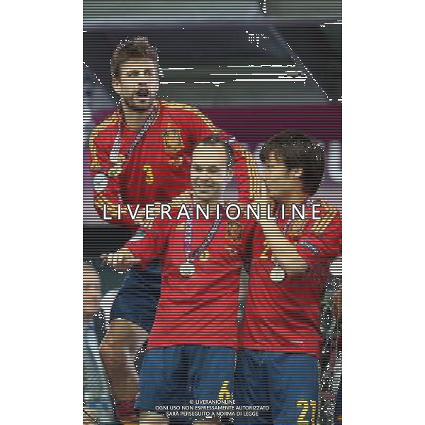 KIJOW STADION OLIMPIJSKI 01.07.2012 EURO 2012 PILKA NOZNA FINAL MISTRZOSTW EUROPY HISZPANIA WLOCHY NZ HISZPANIA RADOSC ZWYCIESTWO MISTRZOSTWO MISTRZ EUROPY FETA GERARD PIQUE SPA ANDRES INIESTA SPA DAVID SILVA SPA FOT MICHAL NOWAK / NEWSPIX.PL KYIV OLYMPIC STADIUM 01.07.2012 FOOTBALL SOCCER EURO 2012 FINAL OF UEFA EUROPEAN FOOTBALL CHAMPIONSHIP SPAIN - ITALY SPANISH PLAYERS ARE CELEBRATING AS THEY WON OVER ITALY. SPAIN BECAME EUROPEAN CHAMPIONS MICHAL NOWAK / NEWSPIX.PL --- Newspix.pl /EUROPEO 2012 ITALIA SPAGNA FINALE - AG ALDO LIVERANI SAS - ITALY ONLY - *** Local Caption *** www.newspix.pl mail us: info@newspix.pl call us: 0048 022 23 22 222 --- Polish Picture Agency by Ringier Axel Springer Poland .