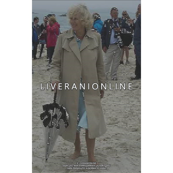 The Duke and Duchess of Cornwall met members of the Tresco and Bryher gig club and vieed the gig on the beach at the Sussex Gig Shed, Bryher, Isles of Scilly, THE DUCHESS STROLLS BAREFOOT ON THE BEACH T TR23 0PR. PHOTOSHOT/AG ALDO LIVERANI SAS - ITALY ONLY -