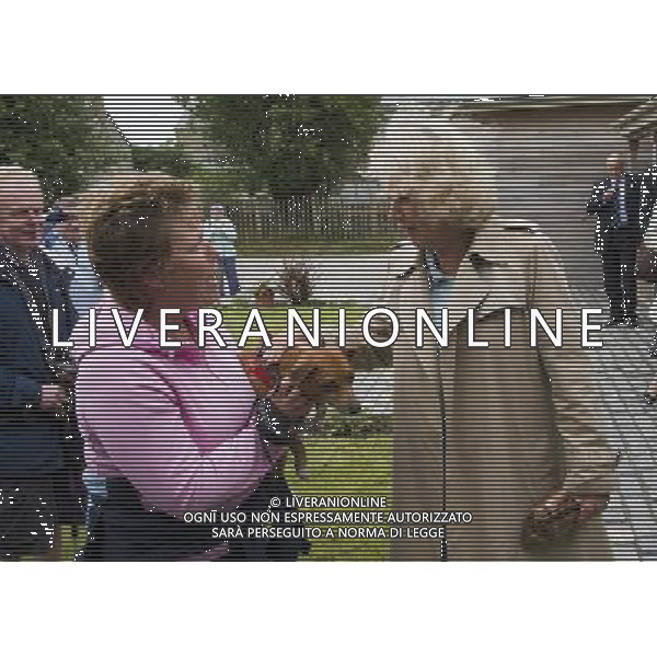 The Duke and Duchess of Cornwall met members of the Tresco anD Bryher gig club and vieed the gig on the beach at the Sussex Gig Shed, Bryher, Isles of Scilly,the Duchess meets a jack russell called Daisy TR23 0PR. PHOTOSHOT/AG ALDO LIVERANI SAS - ITALY ONLY -