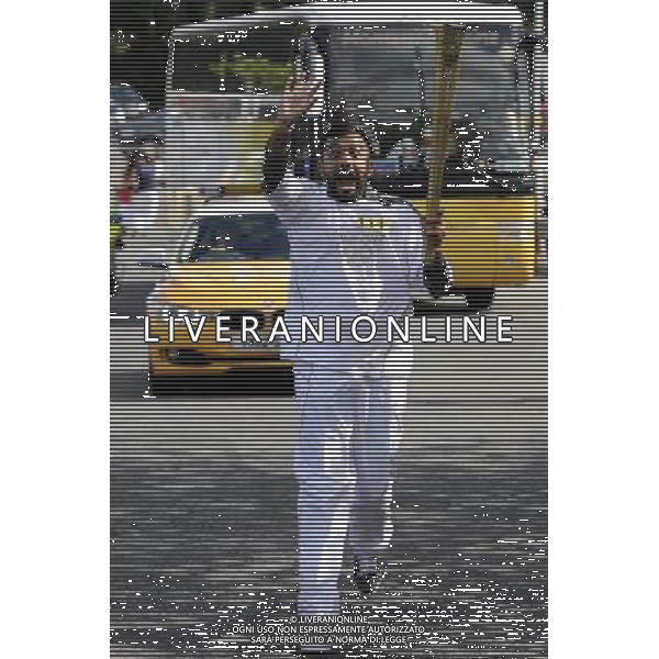 Torchbearer Hussain Manawer carries the Olympic Flame on the Torch Relay leg between Basildon and Grays. /PHOTOSHOT/AG ALDO LIVERANI SAS - ITALY ONLY -