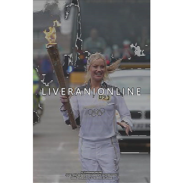 MTV Europe presenter and Torchbearer Laura Whitmore carries the Olympic Flame on the Torch Relay leg between St Ives and Huntingdon. /PHOTOSHOT/AG ALDO LIVERANI SAS - ITALY ONLY -