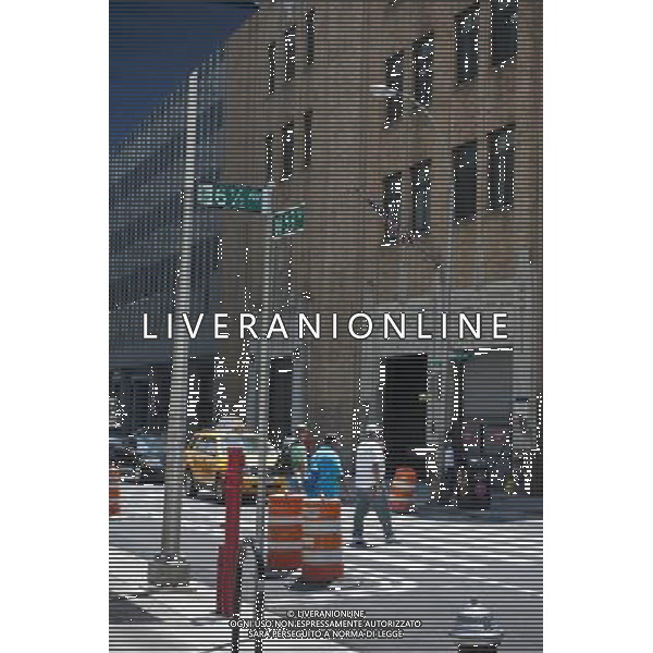 Pedestrians cross Six and one-half Avenue in Midtown Manhattan in New York on Friday, July 6, 2012. The new street is actually a series of interconnected pedestrian arcades, mid-block between Sixth and Seventh Avenues, running from West 51 Street to West 57 Street. The city is in the process of installing signage and pedestrian crossings. Up to 1200 people an hour use the connected arcades to travel through midtown. The arcades are privately owned public spaces that are provided by the buildings\' owners in exchange for zoning variances. (å Richard B. Levine) /PHOTOSHOT/AG ALDO LIVERANI SAS - ITALY ONLY -