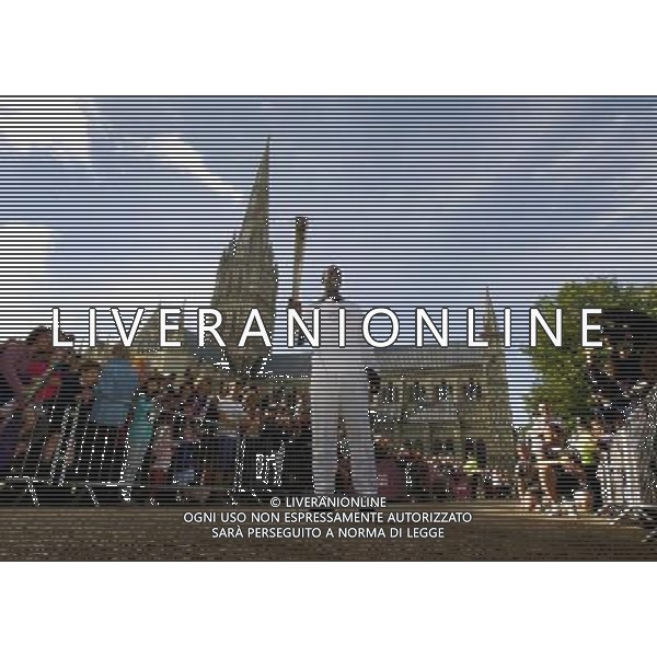 Olympic gold medalist former sprinter Torchbearer 001 Michael Johnson holds the Olympic Flame in front of Salisbury Cathedral during Day 55 of the London 2012 Olympic Torch Relay. PHOTOSHOT/AG ALDO LIVERANI SAS - ITALY ONLY -