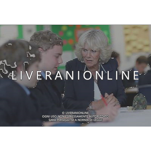 ST HELIER, UNITED KINGDOM - JULY 18: Camilla, Duchess of Conrwall talks to pupils as she visits Grainville Secondary School on July 18, 2012 in St Helier, United Kingdom. The Prince of Wales and the Duchess of Cornwall are in Jersey as part of a Diamond Jubilee visit to the Channel Islands taking in Jersey, Guernsey and Sark. ©photoshot/AGENZIA ALDO LIVERANI SAS - ITALY ONLY - REALI INGLESI: il Principe Carlo d\'inghilterra, Principe di Galles e Camilla duchessa di Cornovaglia in visita presso la scuola secondaria Grainville 18 luglio 2012