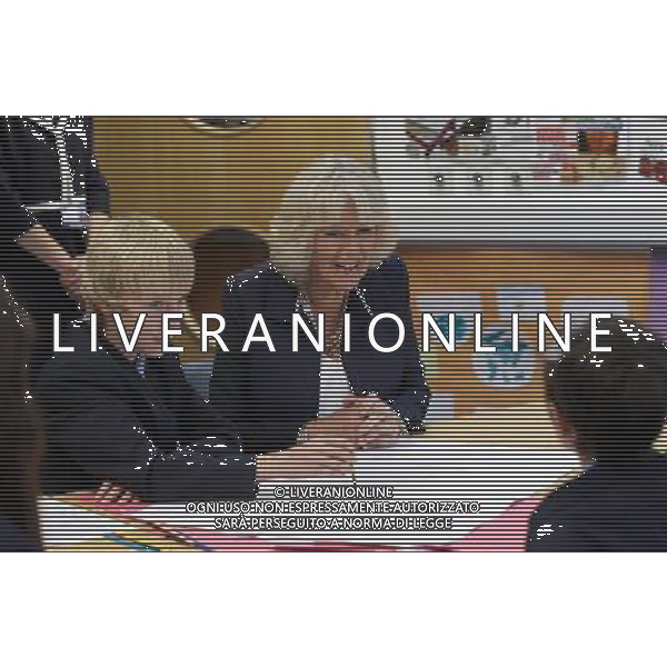 ST HELIER, UNITED KINGDOM - JULY 18: Camilla, Duchess of Conrwall talks to pupils as she visits Grainville Secondary School on July 18, 2012 in St Helier, United Kingdom. The Prince of Wales and the Duchess of Cornwall are in Jersey as part of a Diamond Jubilee visit to the Channel Islands taking in Jersey, Guernsey and Sark ©photoshot/AGENZIA ALDO LIVERANI SAS - ITALY ONLY - REALI INGLESI: il Principe Carlo d\'inghilterra, Principe di Galles e Camilla duchessa di Cornovaglia in visita presso la scuola secondaria Grainville 18 luglio 2012