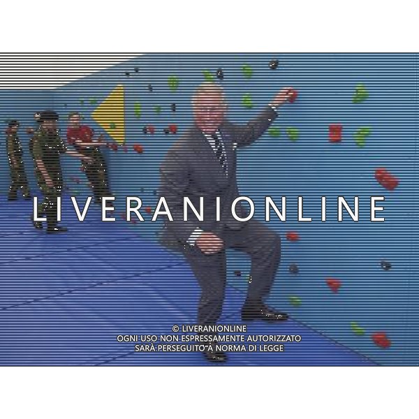 ST HELIER, UNITED KINGDOM - JULY 18: Prince Charles, Prince of Wales climbs on the new traversing wall in the new gym at Grainville Secondary School on July 18, 2012 in St Helier, United Kingdom. The Prince of Wales and the Duchess of Cornwall are in Jersey as part of a Diamond Jubilee visit to the Channel Islands taking in Jersey, Guernsey and Sark. ©photoshot/AGENZIA ALDO LIVERANI SAS - ITALY ONLY - REALI INGLESI: il Principe Carlo d\'inghilterra, Principe di Galles e Camilla duchessa di Cornovaglia in visita presso la scuola secondaria Grainville 18 luglio 2012