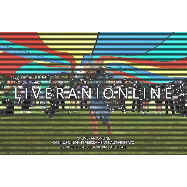 The Duchess of Cornwall runs under a brightly coloured Parachute during a youth rally at Saumarez Park in Guernsey, as they continue their visit to the Channel Islands. ©photoshot/AGENZIA ALDO LIVERANI SAS - ITALY ONLY - REALI INGLESI: Il principe Carlo d\'inghilterra e la moglie Camilla in visita alle Isole Normanne. 