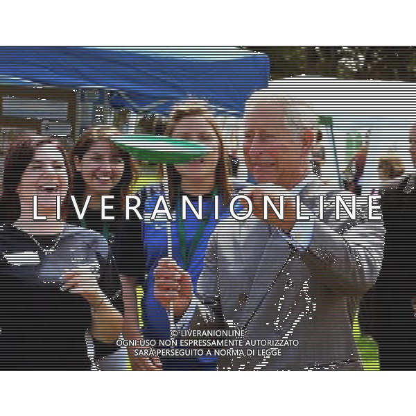 The Prince of Wales tries his hand at plate spinning, during a visit with the Duchess of Cornwall to youth rally at Saumarez Park in Guernsey, as they continue their visit to the Channel Islands. ©photoshot/AGENZIA ALDO LIVERANI SAS - ITALY ONLY - REALI INGLESI: Il principe Carlo d\'inghilterra e la moglie Camilla in visita alle Isole Normanne. 