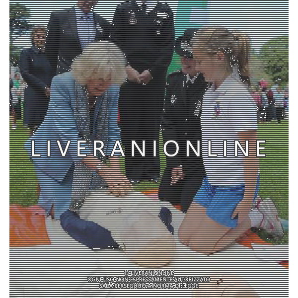 GUERNSEY, GUERNSEY - JULY 19: Camilla, Duchess of Cornwall learns how to perform resuscitation with the St John\'s Ambulance as she takes part in a Youth Showcase during a visit to Saumarez Park on July 19, 2012 in St Peter\'s Port, United Kingdom. The Prince of Wales and the Duchess of Cornwall are in Jersey as part of a Diamond Jubilee visit to the Channel Islands taking in Jersey, Guernsey and Sark ©photoshot/AGENZIA ALDO LIVERANI SAS - ITALY ONLY - REALI INGLESI: Il principe Carlo d\'inghilterra e la moglie Camilla in visita alle Isole Normanne. 
