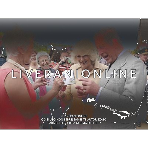 SARK, UNITED KINGDOM - JULY 20: Prince Charles, Prince of Wales and Camilla, Duchess of Cornwall are presented with a commemorative mug of the royal visit by a lady called \'Puffin\', on the Island of Sark on July 20, 2012 in Sark, United Kingdom. The Prince of Wales and the Duchess of Cornwall are in Sark as part of a Diamond Jubilee visit to the Channel Islands taking in Jersey, Guernsey and Sark ©photoshot/Agenzia Aldo Liverani Sas - ITALY ONLY - REALI INGLESI: Il principe Carlo d\'inghilterra e la moglie Camilla in visita alle Isole Normanne.