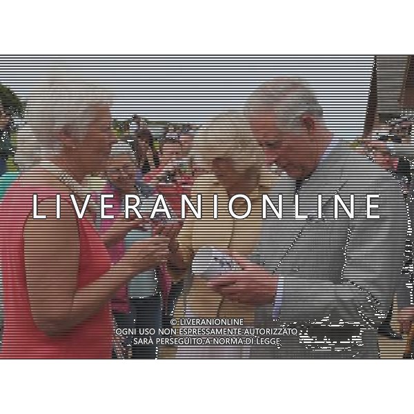 SARK, UNITED KINGDOM - JULY 20: Prince Charles, Prince of Wales and Camilla, Duchess of Cornwall are presented with a commemorative mug of the royal visit by a lady called \'Puffin\', on the Island of Sark on July 20, 2012 in Sark, United Kingdom. The Prince of Wales and the Duchess of Cornwall are in Sark as part of a Diamond Jubilee visit to the Channel Islands taking in Jersey, Guernsey and Sark ©photoshot/AG ALDO LIVERANI SAS - ITALY ONLY -
