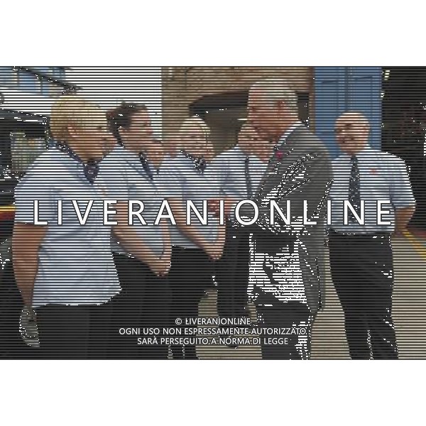 The Prince of Wales talks to staff at the Lifeboat Station in Seahouses, Northumberland during the second day of his tour of the north east. Tuesday July 24, 2012. ©photoshot/Agenzia Aldo Liverani Sas - ITALY ONLY - REALI INGLESI: Il Principe Carlo d\'inghilterra durante la visita nel nord-est 23 luglio 2012.