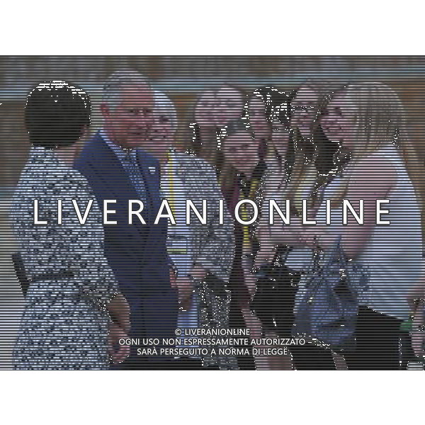 The Prince of Wales accompanied by the Duchess of Northumberland meets volunteers as they walk through Alnwick Gardens, Northumberland during the second day of his tour of the north east. Tuesday July 24, 2012. ©photoshot/Agenzia Aldo Liverani Sas - ITALY ONLY - REALI INGLESI: Il Principe Carlo d\'inghilterra durante la visita nel nord-est 23 luglio 2012.