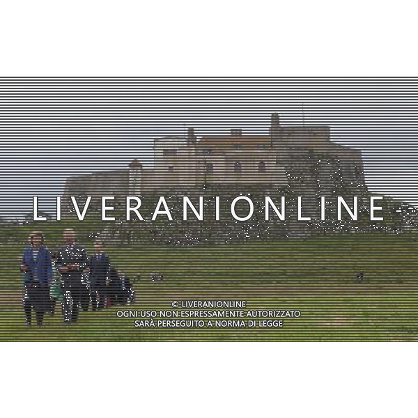 The Prince of Wales accompanied by gardener Philippa Hodkinson (left) tours the grounds of Lindisfarne Castle, Holy Island, Northumberland during the second day of his tour of the north east. Tuesday July 24, 2012. ©photoshot/Agenzia Aldo Liverani Sas - ITALY ONLY - REALI INGLESI: Il Principe Carlo d\'inghilterra durante la visita nel nord-est 23 luglio 2012.