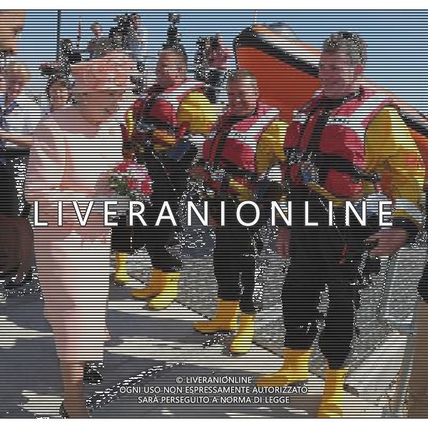 COWES, ENGLAND - JULY 25: Queen Elizabeth II smiles as she visit Cowes Lifeboat Station during her Diamond Jubilee visit to the Isle of Wight on July 25, 2012 in Cowes, England. The Queen and Duke of Edinburgh\'s visit to the Isle of Wight is the final stop on her Diamond Jubilee tour of the country during which she has visited 10 regions in the UK over 25 days and conducted 83 public engagements. photoshot/ALDO LIVERANI ITALY ONLY