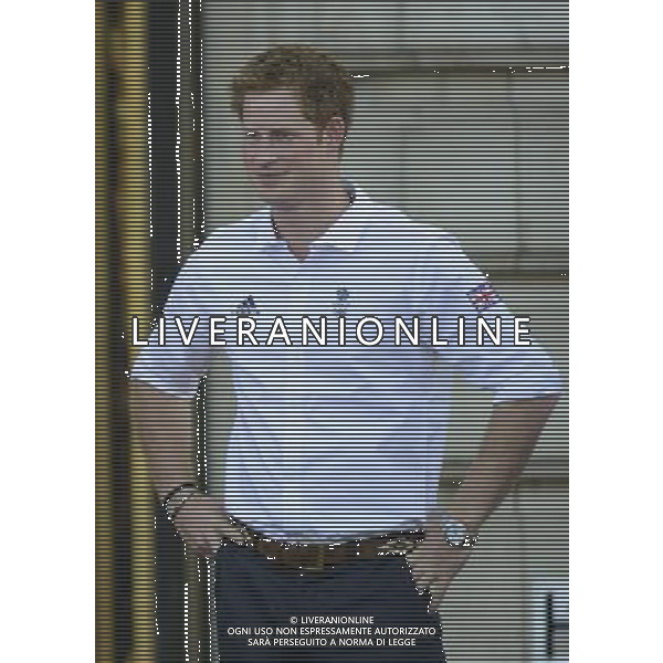 (1805201by) Prince Harry Olympic Torch Relay passes through Buckingham Palace, London, Britain - 26 Jul 2012 PHOTOSHOT/AG ADO LIVERANI SAS - ITALY ONLY -