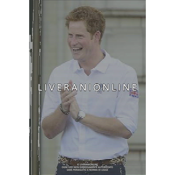 (1805201bz) Prince Harry Olympic Torch Relay passes through Buckingham Palace, London, Britain - 26 Jul 2012 PHOTOSHOT/AG ADO LIVERANI SAS - ITALY ONLY -