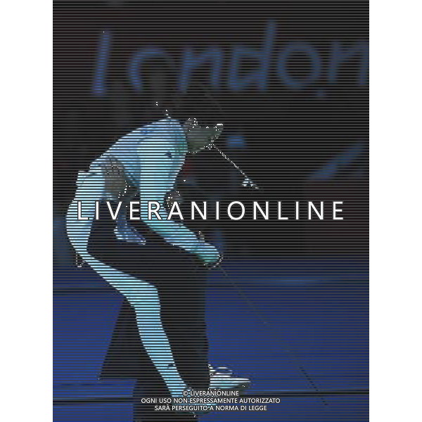 (120728) -- LONDON, July 28, 2012 () -- Elisa Di Francisca (L) of Italy celebrates with her coach after winning women\'s foil individual final of fencing against her teammate Arianna Errigo, at the London 2012 Olympic Games in London, Britain, July 28, 2012. Francisca won the gold medal in this event. (/Zeng Yi) (zgp) photoshot/ag aldo liverani ITALY ONLY -
