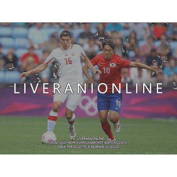 Switzerland\'s Fabian SCHAER battles with Korea Republic\'s PARK Chuyoung 2012 London Olympics - Football - Group B -Korea Republic v Switzerland - Sunday 29th July 2012 - City of Coventry Stadium - Coventry © CameraSport - 43 Linden Ave. Countesthorpe. Leicester. England. LE8 5PG - Tel: +44 (0) 116 277 4147 - admin@camerasport.com - www.camerasport.com /ALDO LIVERANI SAS-ITALY ONLY - EDITORIAL USE ONLY