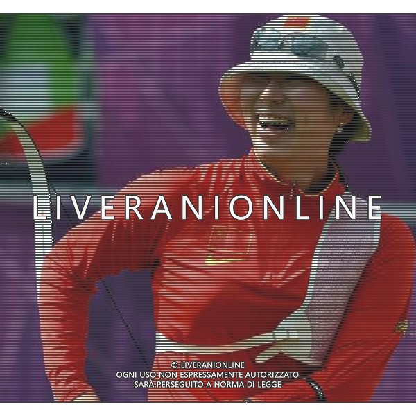 (120729) -- LONDON, July 29, 2012 () -- Xu Jing of China smiles after the women\'s team 1/8 eliminations of archery between China and Italy, at the London 2012 Olympic Games in London, Britain, July 29, 2012. The Chinese team won the match and was qualified for the next round. (/Gesang Dawa) (zgp) /ALDO LIVERANI SAS-ITALY ONLY - EDITORIAL USE ONLY