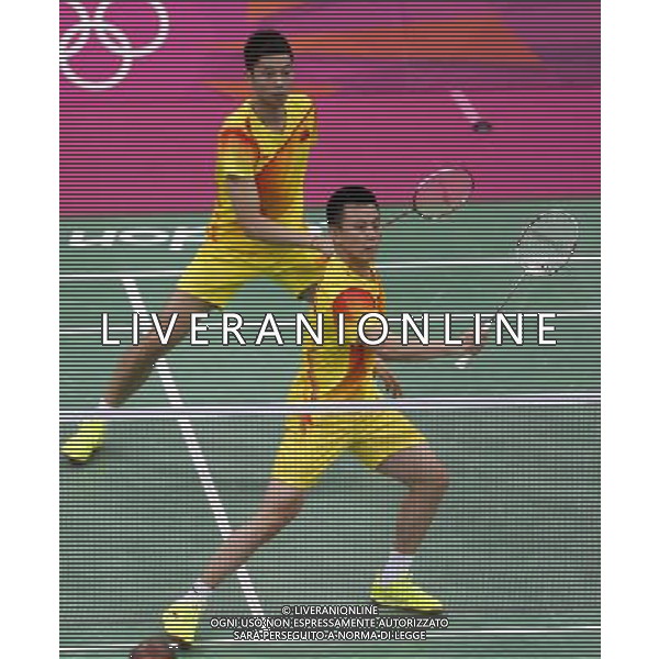 (120729) -- LONDON, July 29, 2012 () -- Chai Biao and Guo Zhendong of China competes during men\'s doubles match of badminton event against Dorian Lance James and Willem Viljoen of South Africa at London 2012 Olympic Games, London, Britain, July 29, 2012. Chai Biao and Guo Zhendong won the match 21-8, 21-13. (/Tang Shi) /ALDO LIVERANI SAS-ITALY ONLY - EDITORIAL USE ONLY