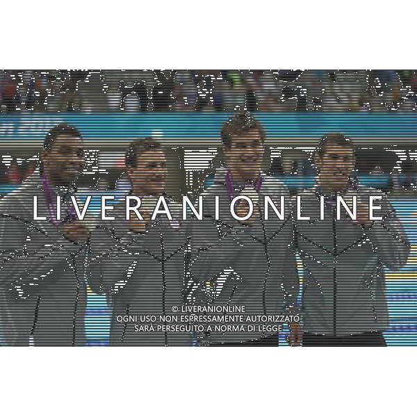 (120729) -- LONDON, July 29, 2012 () -- Members of the United States team celebrate after winning silver medal in men\'s swimming 4x100m freestyle relay final contest, at London 2012 Olympic Games in London, Britain, on July 29, 2012. The French team won gold medal. (/Fei Maohua) (nxl) /ALDO LIVERANI SAS-ITALY ONLY - EDITORIAL USE ONLY