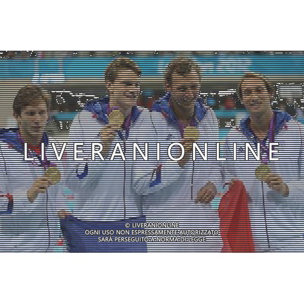 (120729) -- LONDON, July 29, 2012 () -- Members of the French team celebrate after winning in men\'s swimming 4x100m freestyle relay final contest, at London 2012 Olympic Games in London, Britain, on July 29, 2012. The French team won gold medal. (/Fei Maohua) (nxl) /ALDO LIVERANI SAS-ITALY ONLY - EDITORIAL USE ONLY