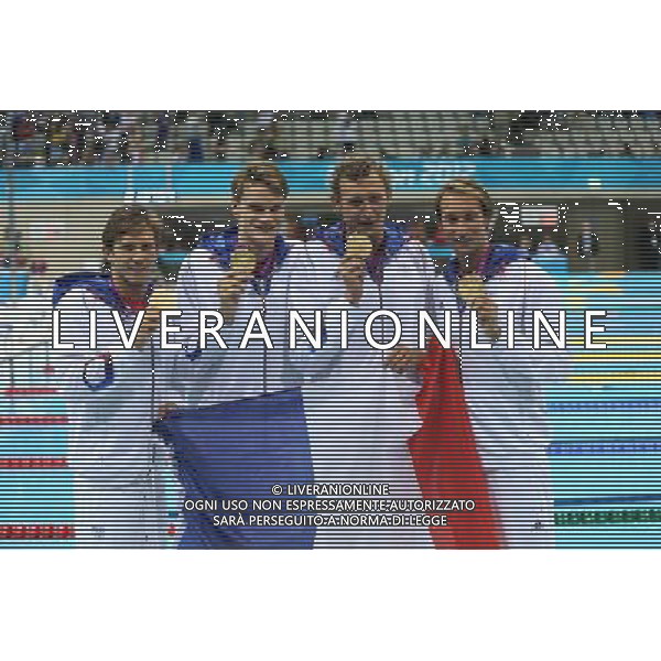 (120729) -- LONDON, July 29, 2012 () -- Members of the French team celebrate after winning in men\'s swimming 4x100m freestyle relay final contest, at London 2012 Olympic Games in London, Britain, on July 29, 2012. The French team won gold medal. (/Fei Maohua) (nxl) /ALDO LIVERANI SAS-ITALY ONLY - EDITORIAL USE ONLY