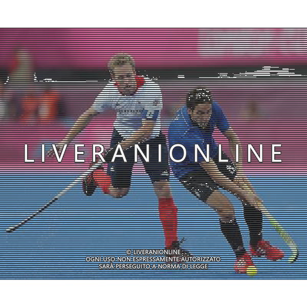 (120730) -- LONDON, July 30, 2012 () -- Lucas Rey (R) of Argentina competes during men\'s hockey preliminary match between Britain and Argentina, at London 2012 Olympic Games in London, Britain, on July 30, 2012. Britain defeated Argentina 4-1. (/Liao Yujie) (nxl) AG ALDO LIVERANI S A S ONLY ITALY