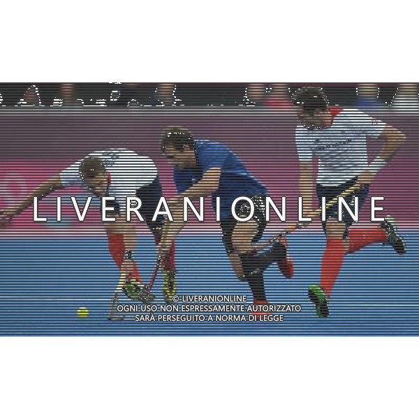 (120730) -- LONDON, July 30, 2012 () -- Lewers Iain (R) of Britain competes during men\'s hockey preliminary match between Britain and Argentina, at London 2012 Olympic Games in London, Britain, on July 30, 2012. Britain defeated Argentina 4-1. (/Li Ga) (nxl) AG ALDO LIVERANI S A S ONLY ITALY