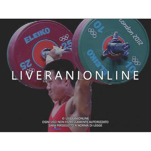 (120730) -- LONDON, July 30, 2012 () -- Kim Un Guk of the Democratic People\'s Republic of Korea celebrates after winning men\'s weightlifting 62kg contest, at London 2012 Olympic Games in London, Britain, on July 30, 2012. Kim Un Guk claimed the title of the event and set a new World Record of total with a weight of 327kg. (/Chen Jianli) (nxl) AG ALDO LIVERANI S A S ONLY ITALY
