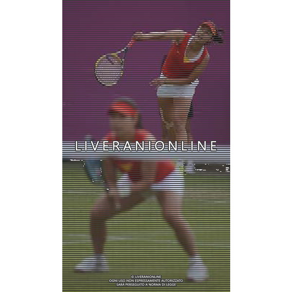 (120730) -- LONDON, July 30, 2012 () -- Zheng Jie and Peng Shuai of China take part in women\'s tennis doubles 2nd round match at London 2012 Olympic Games in London, Britain, on July 30, 2012. The Chinese duet defeated Nuria Llagostera Vives and Maria Jose Martinez Sanchez of Spain 2-0. (/Tao Xiyi) (nxl) AG ALDO LIVERANI S A S ONLY ITALY