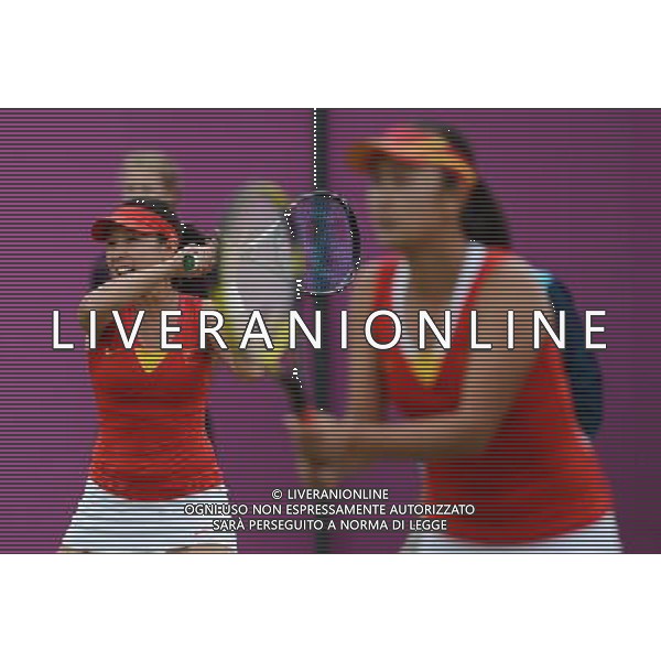 (120730) -- LONDON, July 30, 2012 () -- Zheng Jie and Peng Shuai of China take part in women\'s tennis doubles 2nd round match at London 2012 Olympic Games in London, Britain, on July 30, 2012. The Chinese duet defeated Nuria Llagostera Vives and Maria Jose Martinez Sanchez of Spain 2-0. (/Tao Xiyi) (nxl) AG ALDO LIVERANI S A S ONLY ITALY