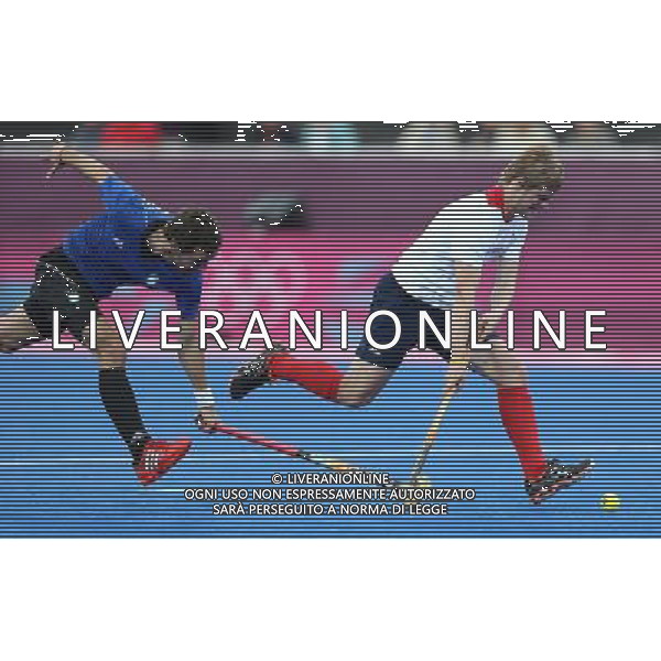 (120730) -- LONDON, July 30, 2012 () -- Ashley Jackson (R) of Britain runs during men\'s hockey preliminary match between Britain and Argentina, at London 2012 Olympic Games in London, Britain, on July 30, 2012. Britain defeated Argentina 4-1. (/Liao Yujie) (nxl) AG ALDO LIVERANI S A S ONLY ITALY