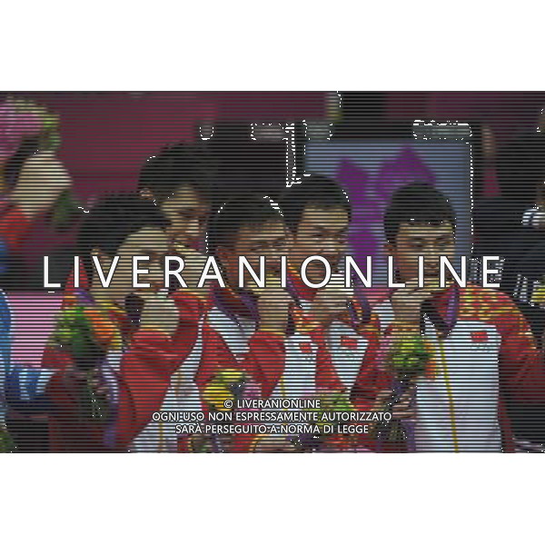 (120730) -- LONDON, July 30, 2012 () -- Chinese gymnasts celebrate during the victory ceremony after Gymnastics Artistic men\'s team final contest, at London 2012 Olympic Games in London, Britain, on July 30, 2012. The Chinese team won gold medal. (/Wang Jianhua) (nxl) AG ALDO LIVERANI S A S ONLY ITALY