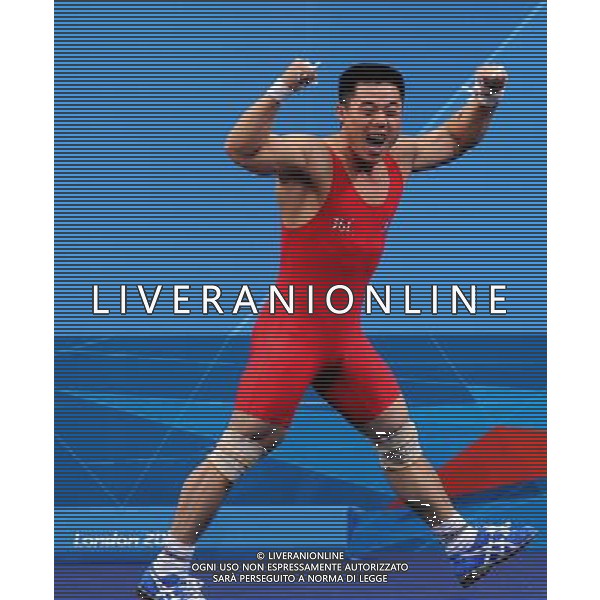 (120730) -- LONDON, July 30, 2012 () -- Kim Un Guk of the Democratic People\'s Republic of Korea celebrates after winning men\'s weightlifting 62kg contest, at London 2012 Olympic Games in London, Britain, on July 30, 2012. Kim Un Guk claimed the title of the event and set a new World Record of total with a weight of 327kg. (/Gong Lei) AG ALDO LIVERANI S A S ONLY ITALY