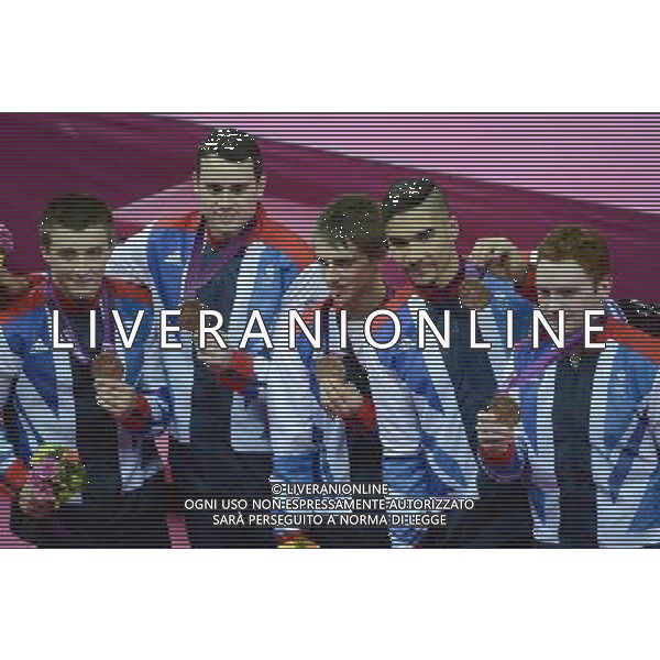 (120730) -- LONDON, July 30, 2012 () -- British gymnasts pose with bronze medal at the awarding ceremony of Gymnastics Artistic men\'s team contest, at London 2012 Olympic Games in London, Britain, on July 30, 2012. The British team won bronze medal. (/Qi Heng) (zgp) AG ALDO LIVERANI S A S ONLY ITALY