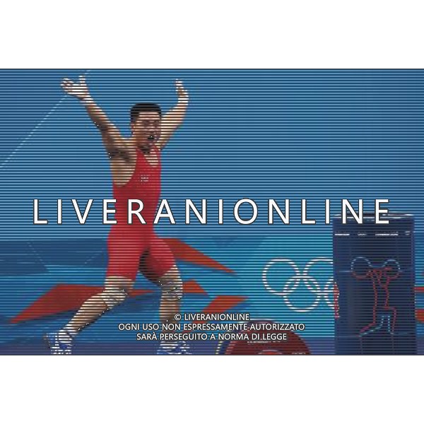 (120730) -- LONDON, July 30, 2012 () -- Kim Un Guk of the Democratic People\'s Republic of Korea celebrates after winning men\'s weightlifting 62kg contest, at London 2012 Olympic Games in London, Britain, on July 30, 2012. Kim Un Guk claimed the title of the event and set a new World Record of total with a weight of 327kg. (/Gong Lei) AG ALDO LIVERANI S A S ONLY ITALY