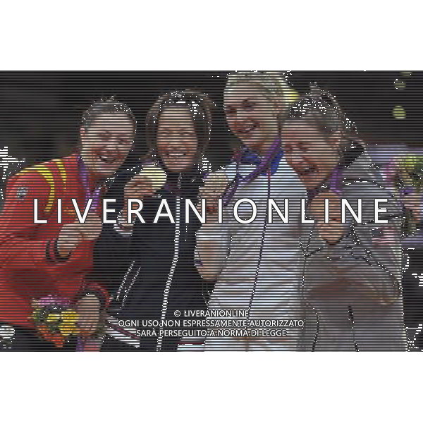 (120730) -- LONDON, July 30, 2012 () -- Gold medalist Kaori Matsumoto of Japan (2nd L), silver medalist Corina Caprioriu of Romania (1st L), and bronze medalists Marti Malloy of the United States (1st R) and Automne Pavia of France pose at the awarding ceremony of women\'s 57kg judo event at London 2012 Olympic Games, London, Britain, July 30, 2012. (/Chen Xiaowei) AG ALDO LIVERANI S A S ONLY ITALY