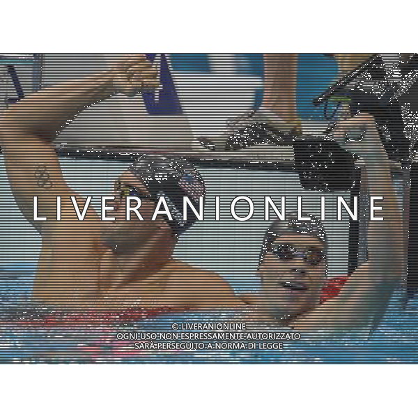 (120730) -- LONDON, July 30, 2012 () -- Matthew Grevers (L) of U.S. celebrates after men\'s 100m backstroke final of swimming at the London 2012 Olympic Games in London, Britain, July 30, 2012. Matthew Grevers of U.S. claimed the title and set a new Olympic record with 52.16. (/Liu Dawei)(zgp) AG ALDO LIVERANI S A S ONLY ITALY