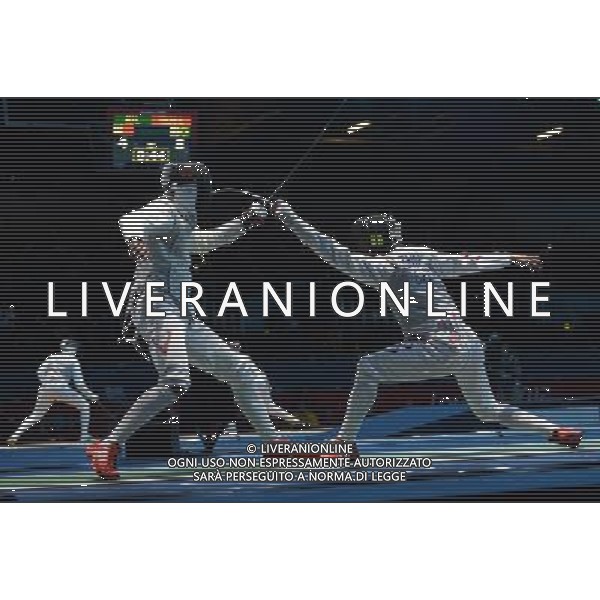 (120731) -- LONDON, July 31, 2012 () -- Zhu Jun of China (R) competes with Zain Shaito of Lebanon during men\'s fencing Foil individual round of 64 competition, at London 2012 Olympic Games in London, Britain, on July 31, 2012. Zhu Jun of China won. (/Zeng Yi) (nxl) ©photoshot/AGENZIA ALDO LIVERANI SAS - ITALY ONLY - Giochi Olimpici - Olimpiadi Londra 2012
